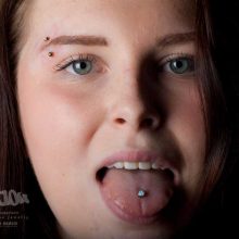 tongue and eyebrow piercing by Matt Bressmer