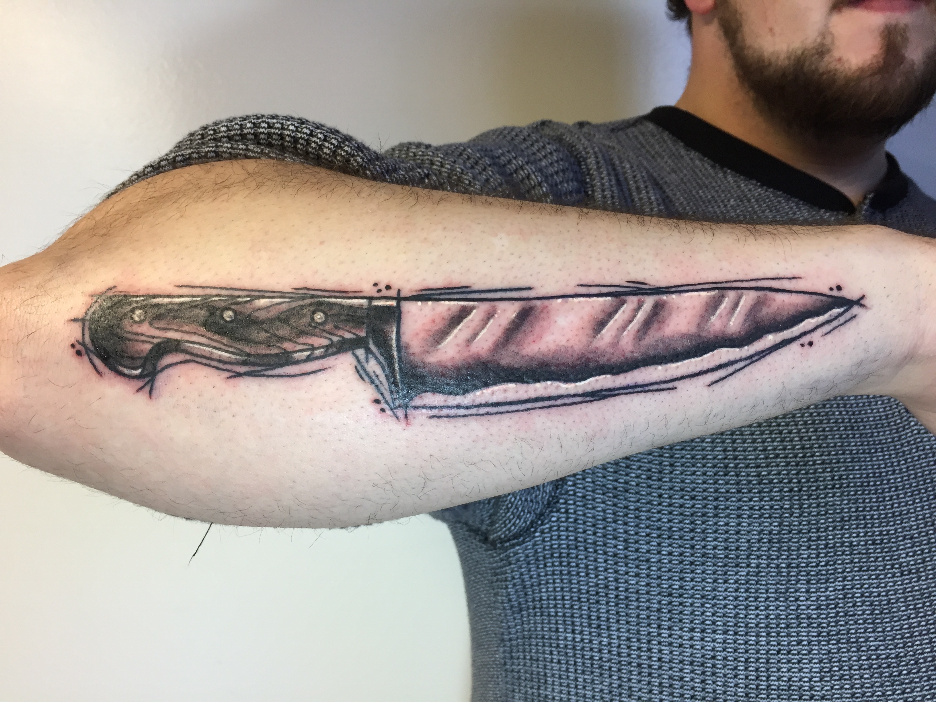 Teemu knife tattoo