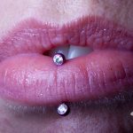 Vertical lip piercing by Matt